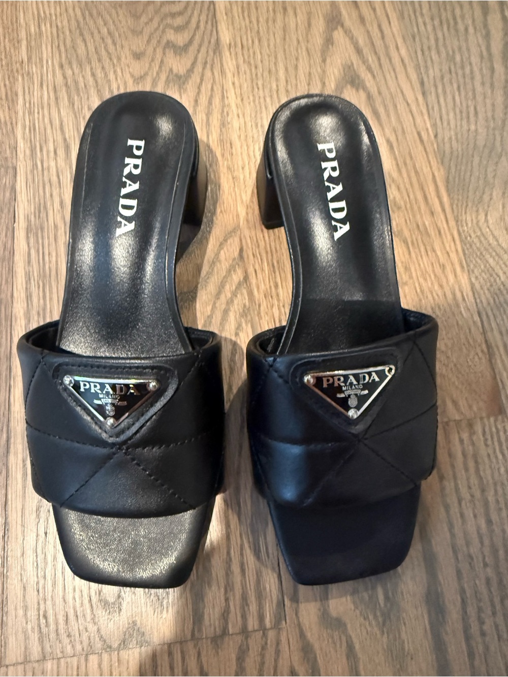 Prada Black Quilted Leather Slide Mules with Logo Plaque